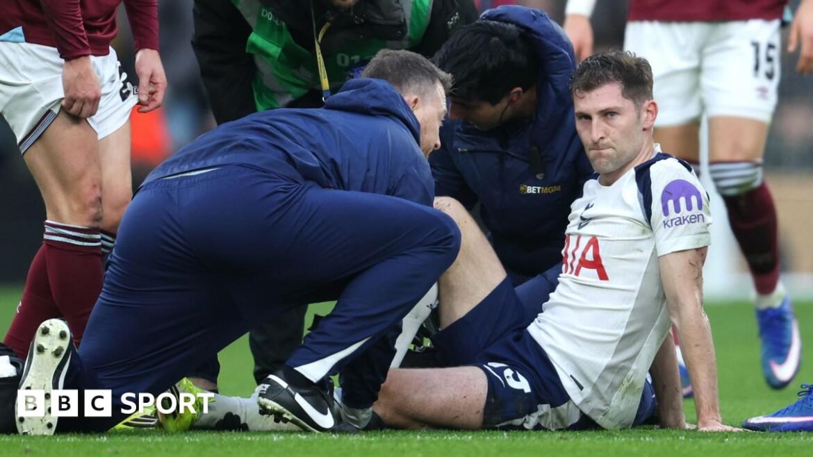 Ben Davies receives treatment from Spurs' medical team