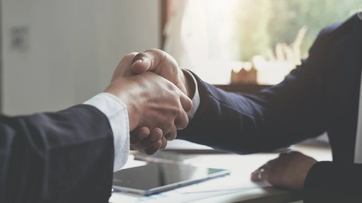 Image of two businesspeople shaking hands