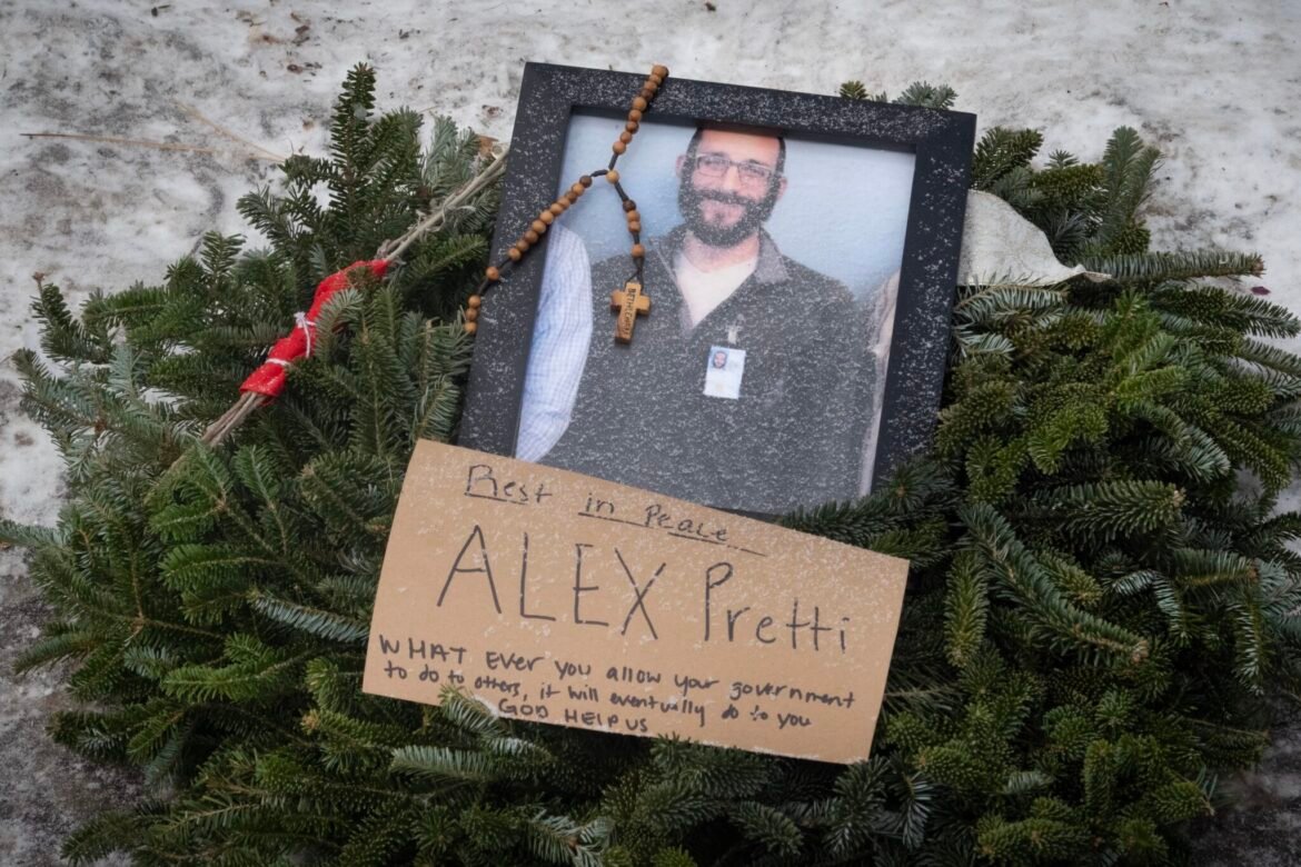 A picture sits at a memorial to Alex Pretti on Jan. 25, 2026 in Minneapolis, Minnesota. Pretti, an ICU nurse at a VA medical center, died on Jan. 24 after being shot multiple times during a brief altercation with border patrol agents in Minneapolis. (Photo by Scott Olson/Getty Images)