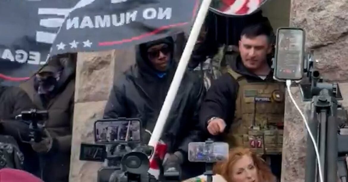 Far-right influencer surrounded by crowd in Minneapolis