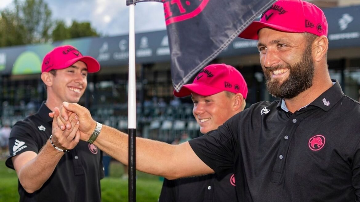 Team Champions captain Jon Rahm, front right, Tyrrell Hatton, left, Caleb Surratt, third from left, and Tom McKibbin, second from left, of Legion XIII, stand near their pin flag on the 18th green following the final round of LIV Golf Team Championship Michigan at The Cardinal at Saint John's, Sunday, Aug. 24, 2025, in Plymouth, Mich. (Scott Taetsch/LIV Golf via AP)