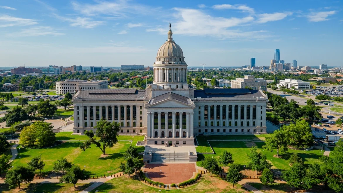 Aerial image of Oklahoma state capitol building with downtown Oklahoma City in the background