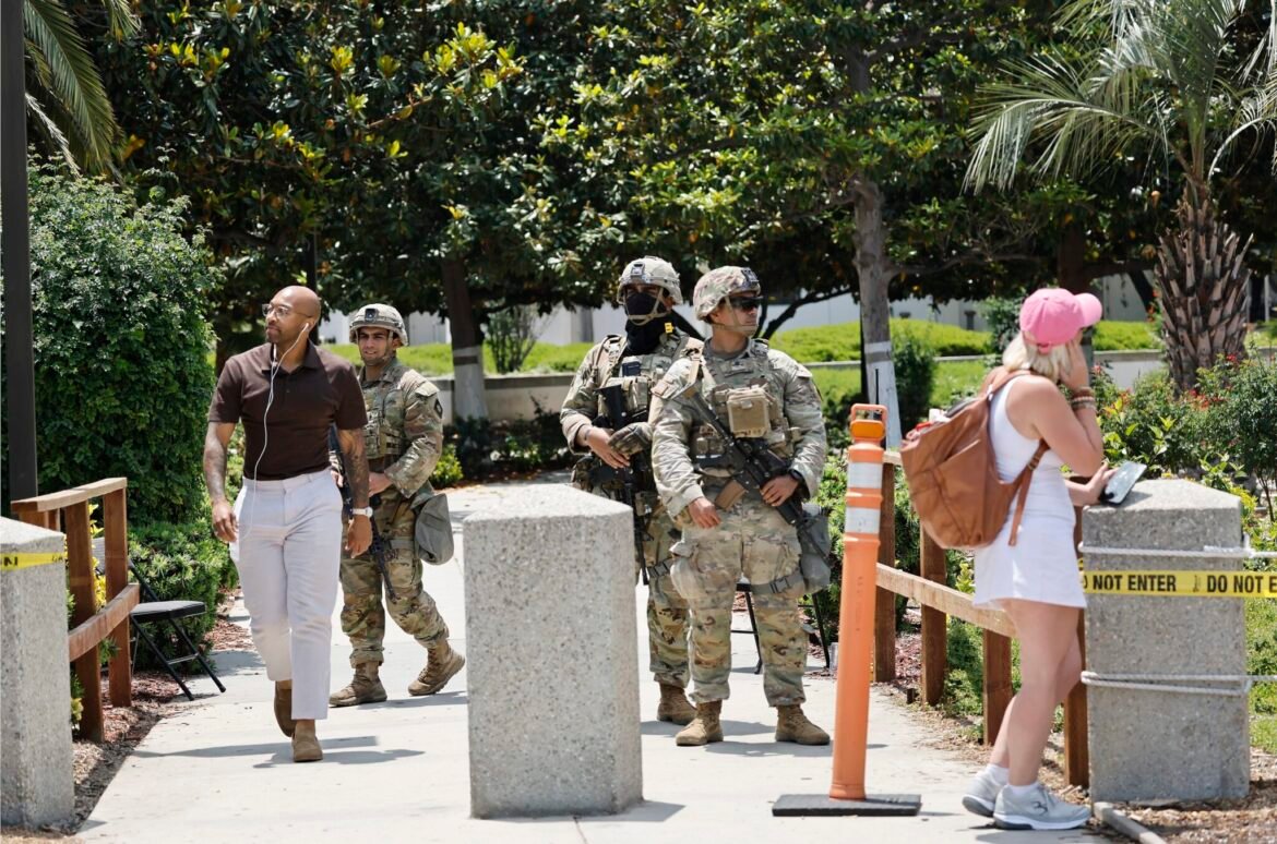 California National Guard members stand guard at an entrance to the Wilshire Federal Building on June 13, 2025, in Los Angeles, California. (Photo by Mario Tama/Getty Images)