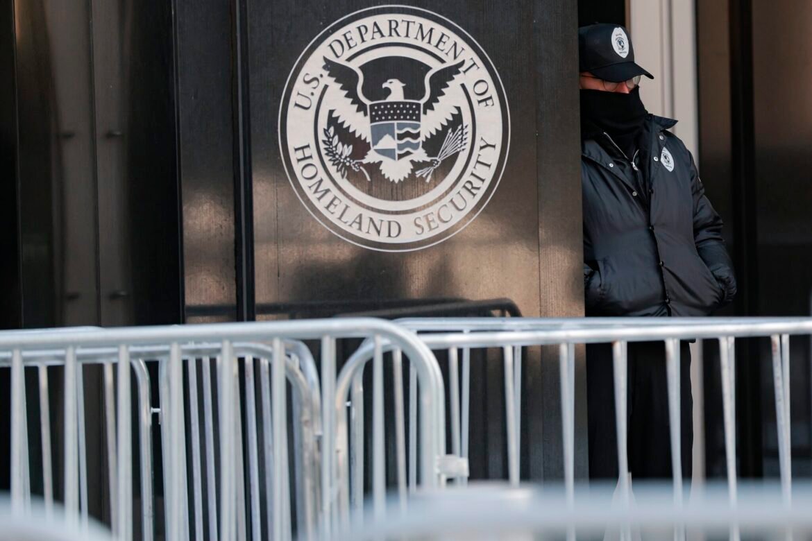 A security officer stands outside Immigration and Customs Enforcement headquarters during a protest on Feb. 3, 2026 in Washington, D.C. (Photo by Heather Diehl/Getty Images)