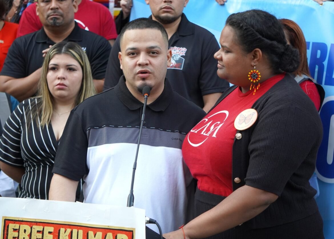 Kilmar Abrego Garcia speaks to people who held a prayer vigil and rally on his behalf outside the Immigration and Customs Enforcement building in Baltimore, Maryland, on Aug. 25, 2025. Lydia Walther Rodriguez with CASA interprets for him. (Photo by William J. Ford/Maryland Matters)