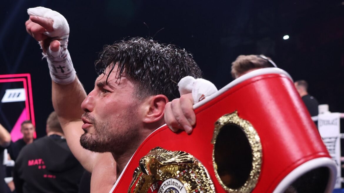 Josh Kelly celebrates beating Bakhram Murtazaliev