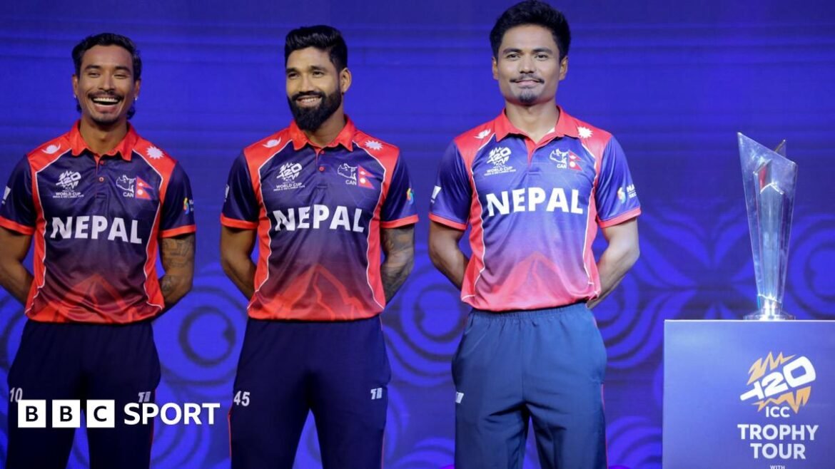 Nepal cricket team players stand beside T20 WC trophy