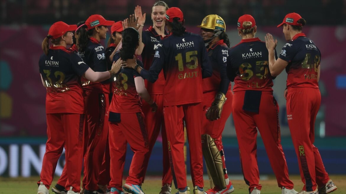 Royal Challengers Bengaluru pacer Lauren Bell celebrates a wicket with RCB teammates. (Express Photo by Amit Chakravarty)