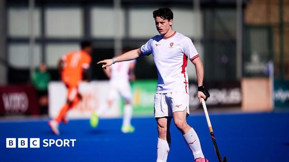 Henry Croft in action for England men's hockey team