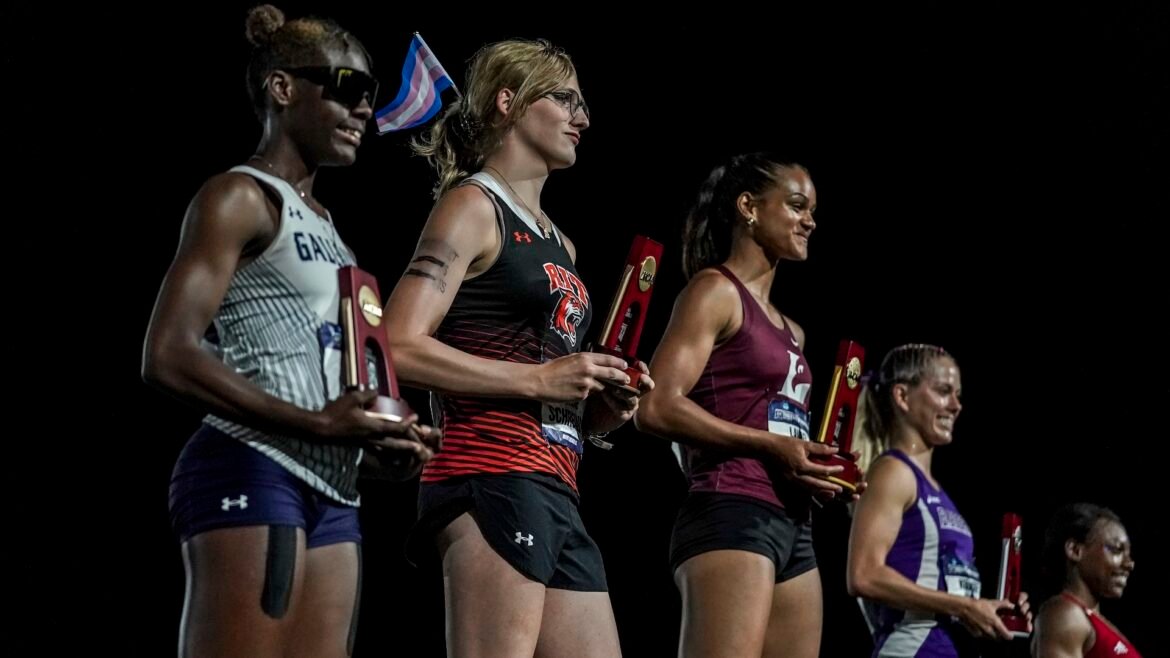 Five track athletes on a podium getting awards