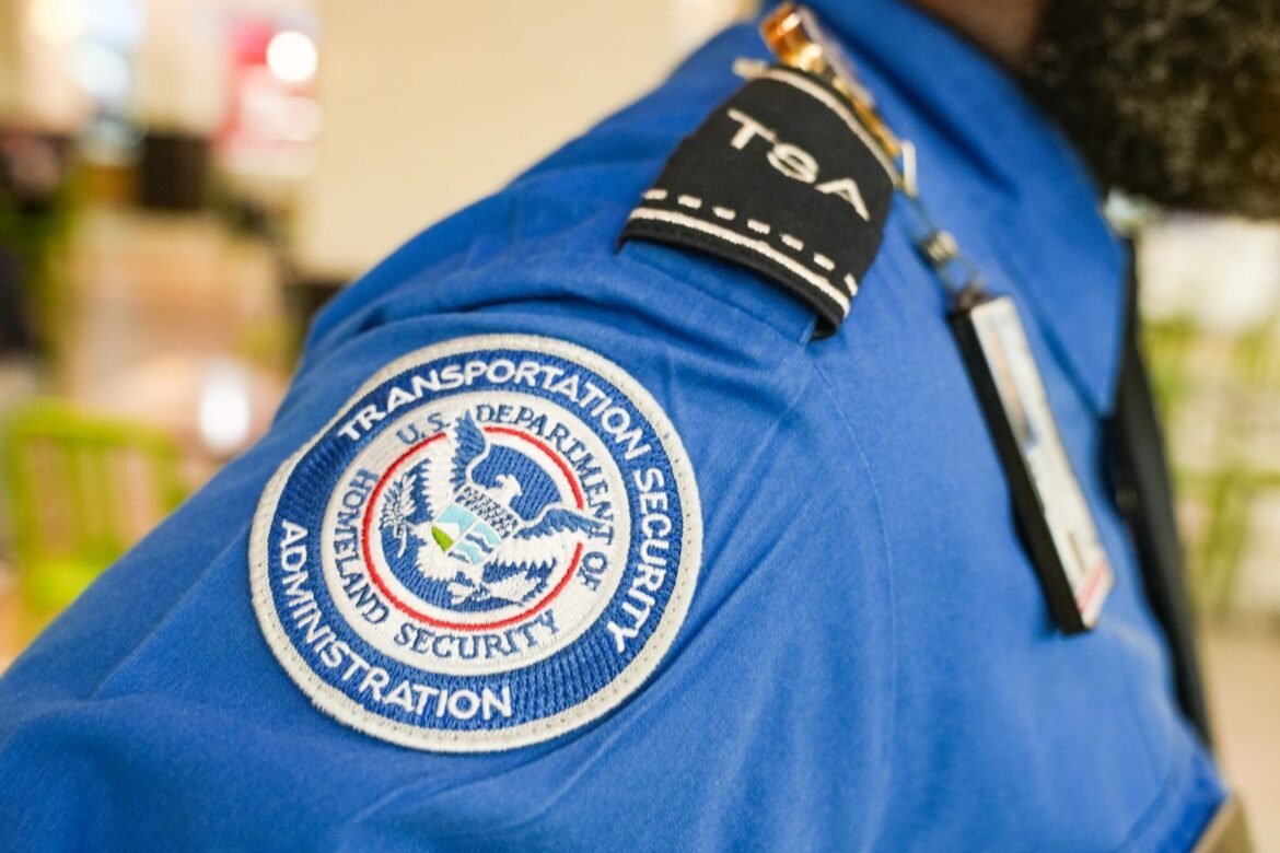 A TSA officer's badge can be seen on their shirt as people travel through Hartsfield-Jackson Atlanta International Airport on Nov. 7, 2025, in Atlanta, Georgia. (Photo by Megan Varner/Getty Images)