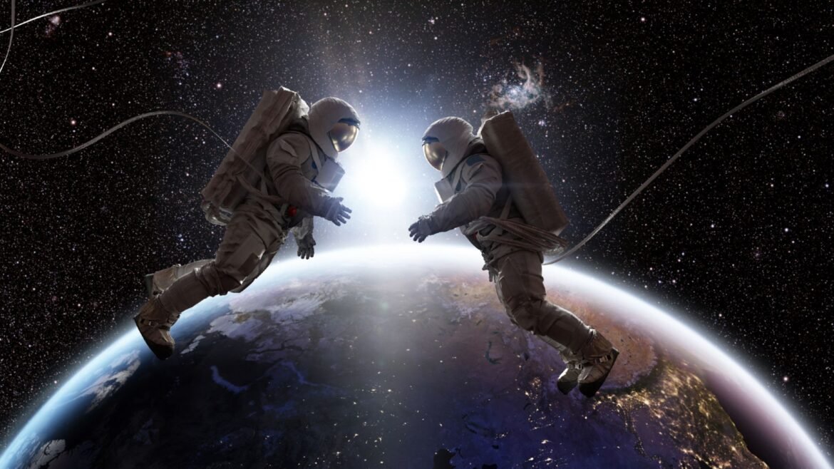 An illustration of two astronauts floating in white space suits above the Earth