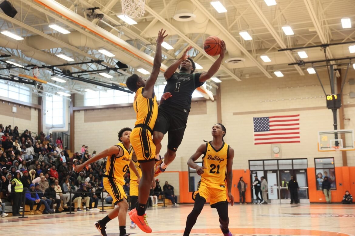 Ayyub Wilson (1) of Arts goes up to the basket while Nosym Brown (1) of Shabazz defends during the Newark Public Schools Tournament boys basketball championship game between Shabazz and Arts at Weequahic High School in Newark, NJ on 12/30/25. 