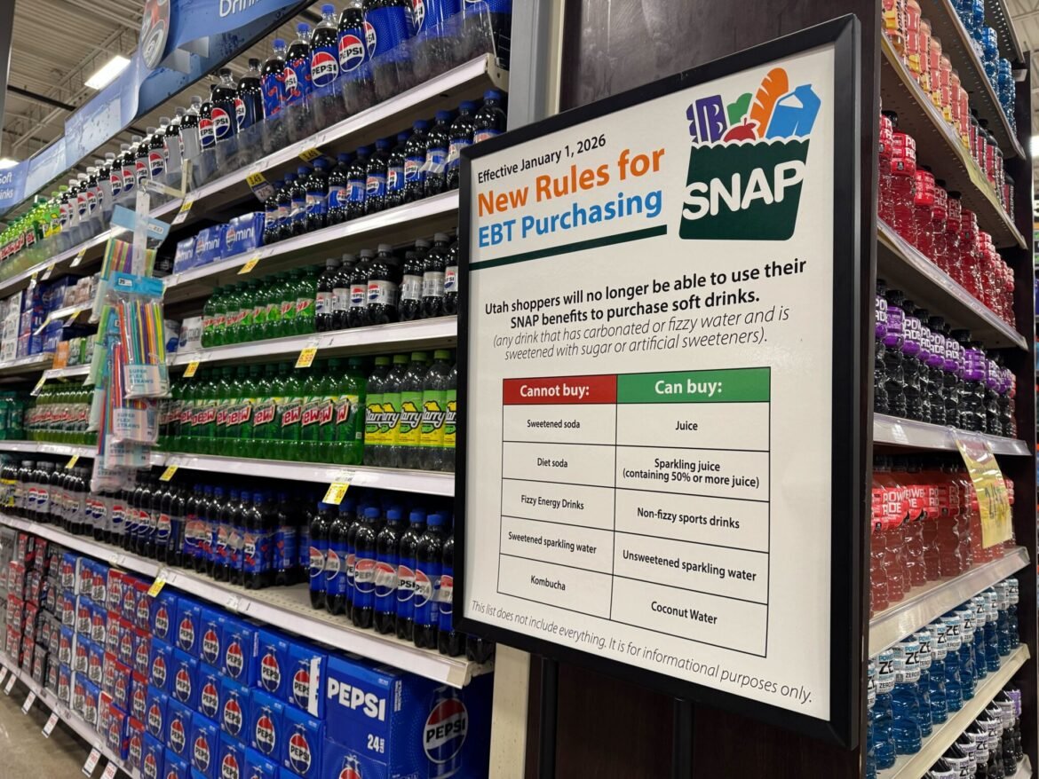 A sign explaining restrictions on buying soda and sweetened drinks using Supplemental Nutrition Assistance Program benefits is displayed in a grocery store in Bountiful, Utah on Feb. 11, 2026. (McKenzie Romero/Utah News Dispatch)