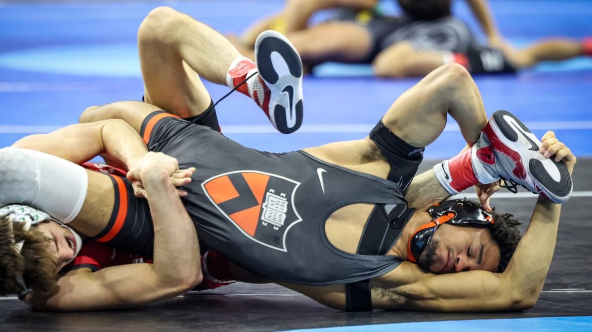Marc-Anthony McGowan of Princeton (right) won an 125-pound bout by 4-3 decision over Brendan McCrone of Ohio State during opening round action at the 2025 NCAA wrestling national championships, Thursday, March 20, 2025, in Philadelphiaz