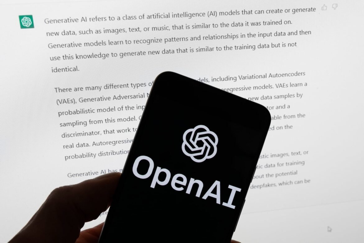 FILE - The OpenAI logo is seen on a mobile phone in front of a computer screen displaying output from ChatGPT, March 21, 2023, in Boston. On Thursday, Feb. 15, 2024, the maker of ChatGPT unveiled its next leap into generative artificial intelligence with a tool that instantly makes short videos in response to written commands.