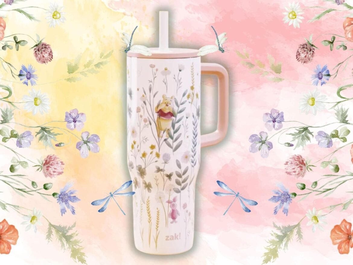 The double-wall insulated tumbler with handle and straw lid features gentle illustrations of beloved Hundred Acre Wood characters.