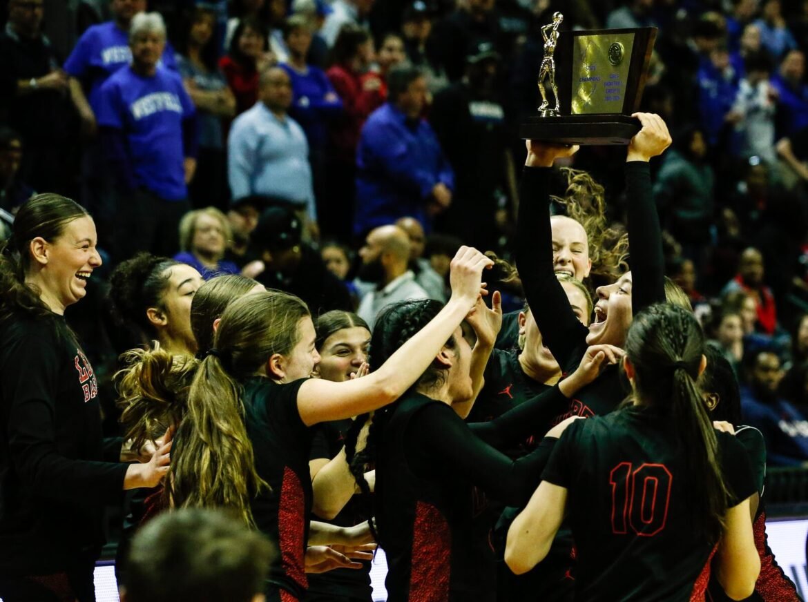 Lenape celebrates with the trophy after winning the NJSIAA Group 4 girls basketball final between Lenape and Westfield at Jersey Mike’s Arena at Rutgers University in Piscataway, NJ on 3/14/26.