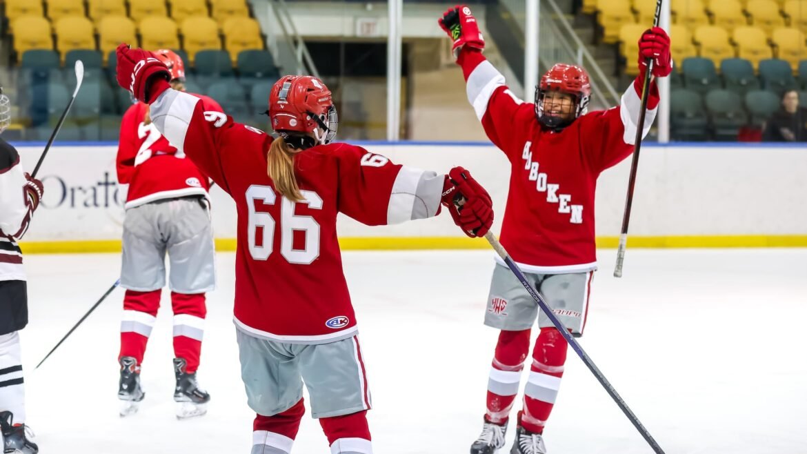 Alexandra Aurebach (66) of Hoboken-Weehawken-Secaucus celebrates with Penelope Campo (27) after scoring a goal against Morristown during the girls hockey Annis Cup Final at Richard J. Codey Arena in West Orange NJ on Thursday, February 19, 2026.