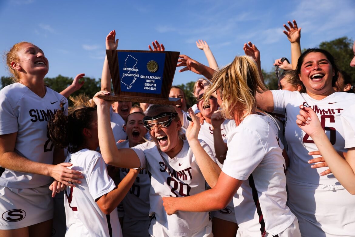 Summit celebrates with the trophy after winning the NJSIAA North, Group 3 Final girls lacrosse game between Chatham and Summit at Chatham High School in Chatham, NJ on Tuesday, June 10, 2025.