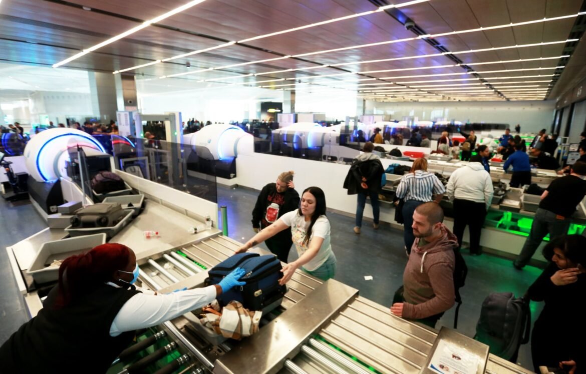 Travelers place bags on conveyor to tomography scanners that enable TSA officers to view 3-D images of contents of carry -on items at Newark Liberty Airport Terminal A, in a file photo. ICE agents could be coming to Newark airport to fill in for TSA agents who have quit or are absent because of the 43-day long government shutdown. 