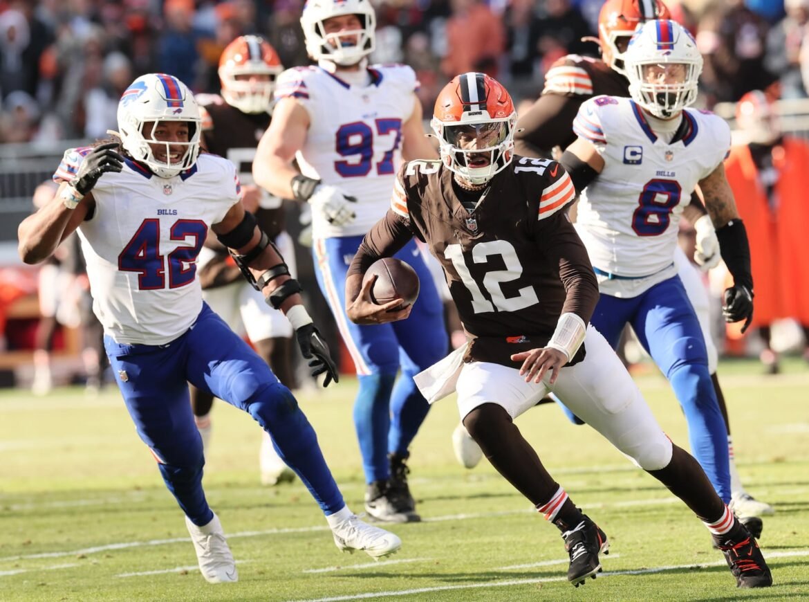 Cleveland Browns quarterback Shedeur Sanders finds running room on a keeper for a first down against the Buffalo Bills in the first half.  