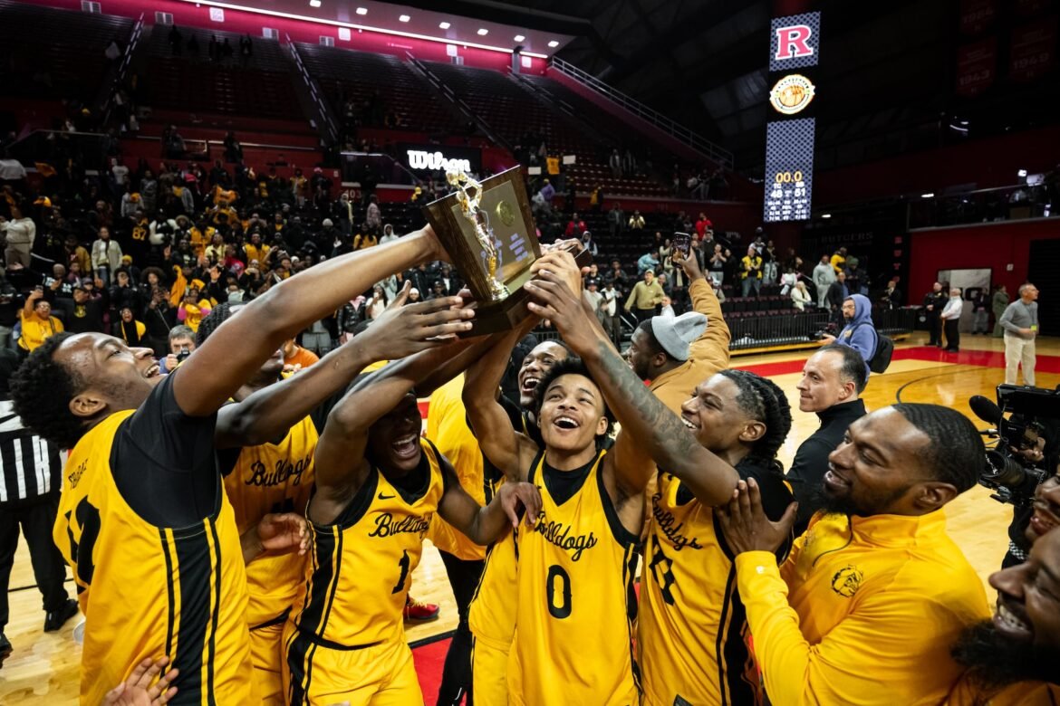 Christian Gray (0) of Shabazz raises the trophy after the win in the NJSIAA Group 1 boys basketball final between Thrive Charter and Shabazz at Jersey Mike's Arena in Piscataway, NJ on Sunday, March 15, 2026.