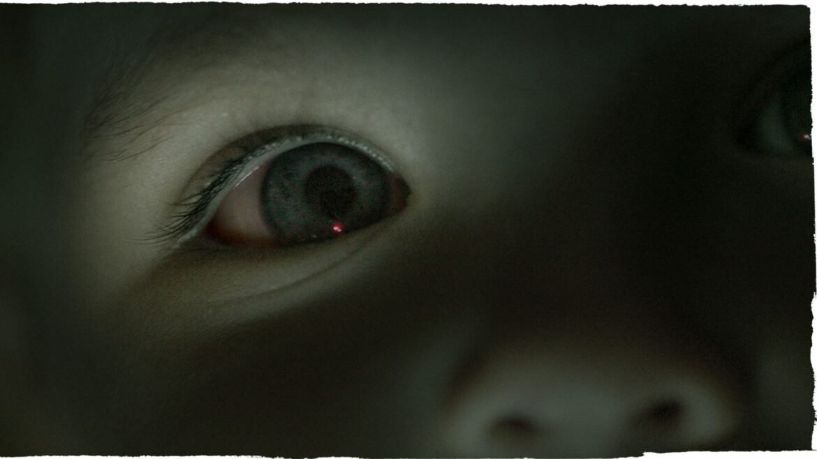 A close up of a child's eye that's blue. The image has a blue tint