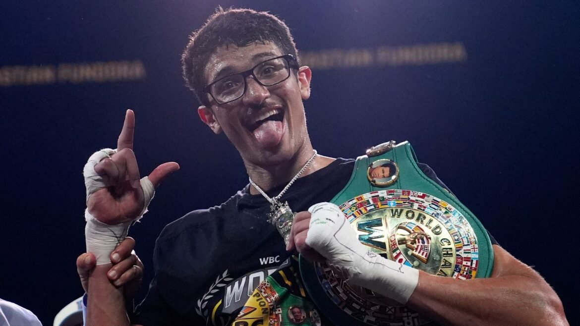 Sebastian Fundora celebrates after defeating Keith Thurman in a super-welterweight bout (Associated Press)
