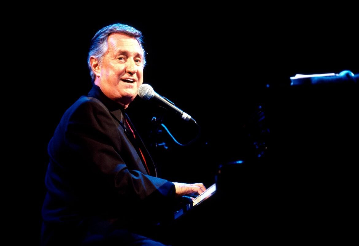 Neil Sedaka, singer-songwriter known best for his '60s and '70s hits, died at the age of 86. (Photo by Brigitte Engl/Redferns via Getty Images)