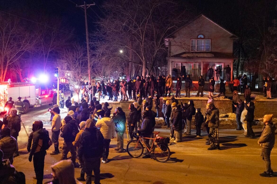 Residents confront federal immigration agents following a shooting incident on Jan. 14, 2026, in Minneapolis, Minnesota. (Photo by Scott Olson/Getty Images)