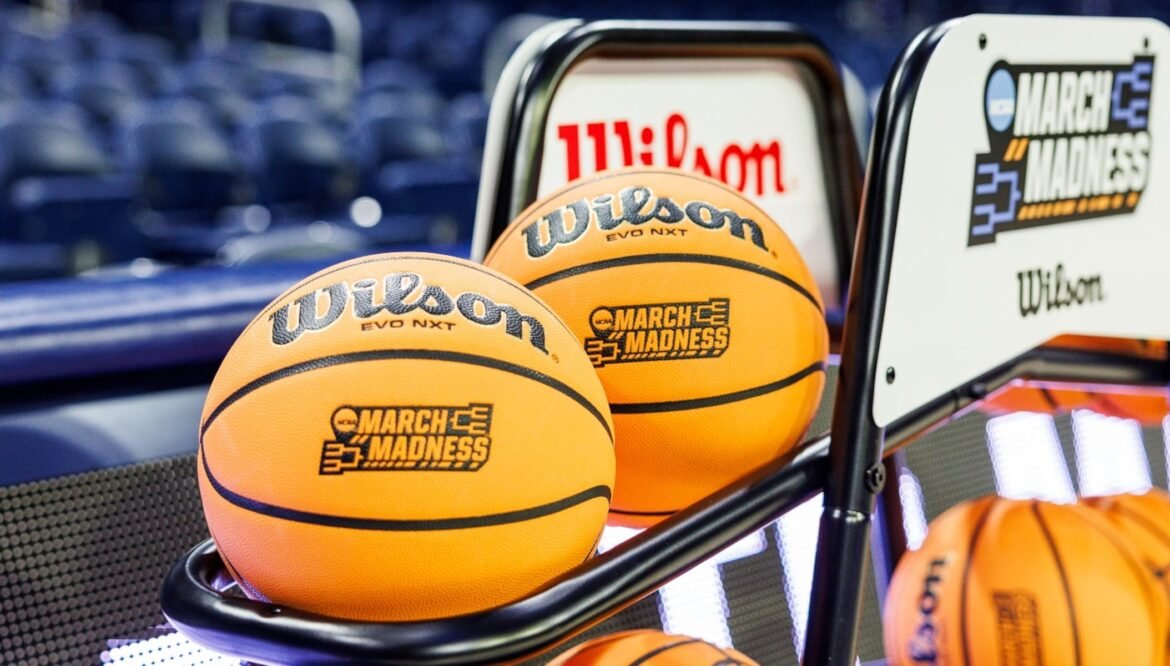 A basketball with a March Madness logo rests on the rack prior to a second round of the NCAA college basketball tournament between Notre Dame and Michigan, Sunday, March 23, 2025, in South Bend, Ind.