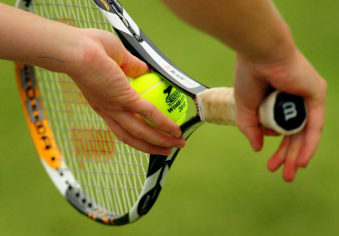 A tennis player gets ready to serve. (Photo by Rui Vieira/PA Images via Getty Images)