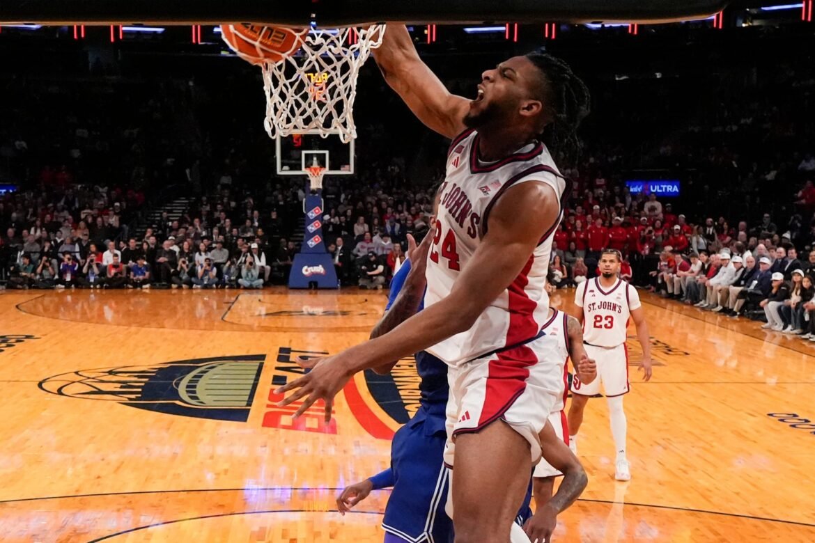 St. John's forward Zuby Ejiofor (24) dunks during the first half of an NCAA college basketball game against the Seton Hall in the semifinals of the Big East tournament, Friday, March 13, 2026, in New York. (AP Photo/Yuki Iwamura)