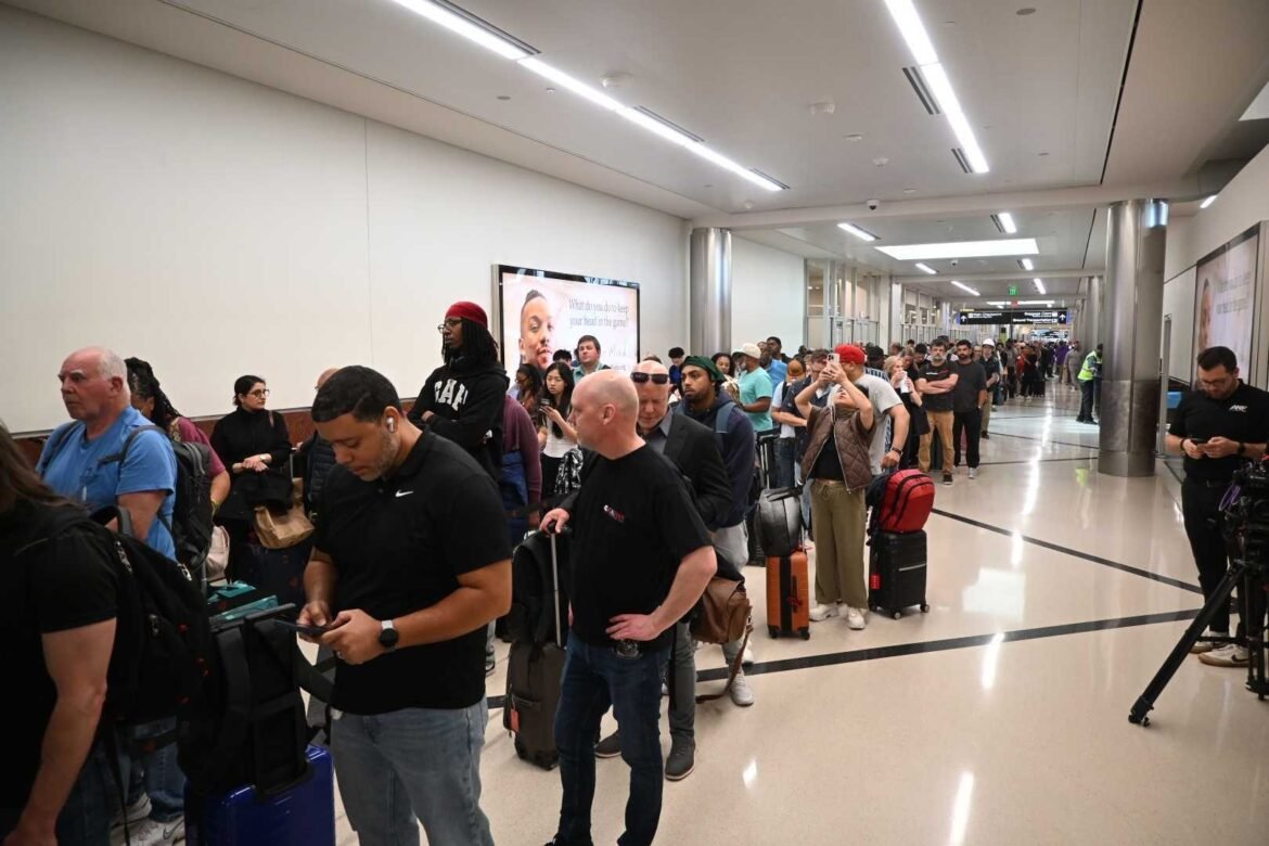 Travelers stand in a long line at Hartsfield-Jackson Atlanta International Airport on Monday, March 23, 2026, the same day federal immigration officials started assisting with airport security. (Photo by Ross Williams/Georgia Recorder)