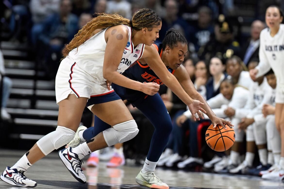 UConn forward Sarah Strong, left, pressures UTSA forward Cheyenne Rowe, right, during the first half in the first round of the NCAA college basketball tournament, Saturday, March 21, 2026, in Storrs, Conn. (AP Photo/Jessica Hill)