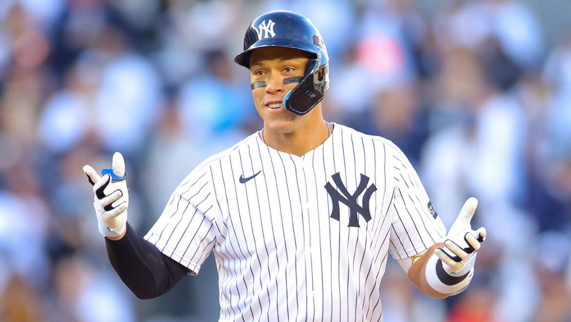 Aaron Judge #99 of the New York Yankees reacts after hitting a an RBI double in the seventh inning against the Milwaukee Brewers on Opening Day at Yankee Stadium on March 27, 2025 in New York City.