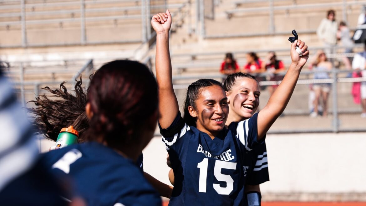 Mya De Jesus (15) and Hailey Scocco (8) of Harrison are all smiles after winning the NJIC final flag football game between Harrison and Leonia at Harrison High School in Harrison, NJ on Tuesday, June 4, 2024.