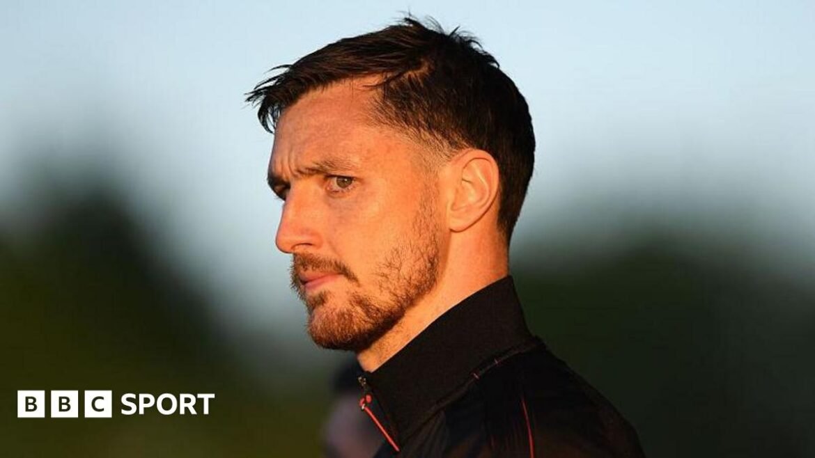 Dom Hyam looks on as he arrives at the ground