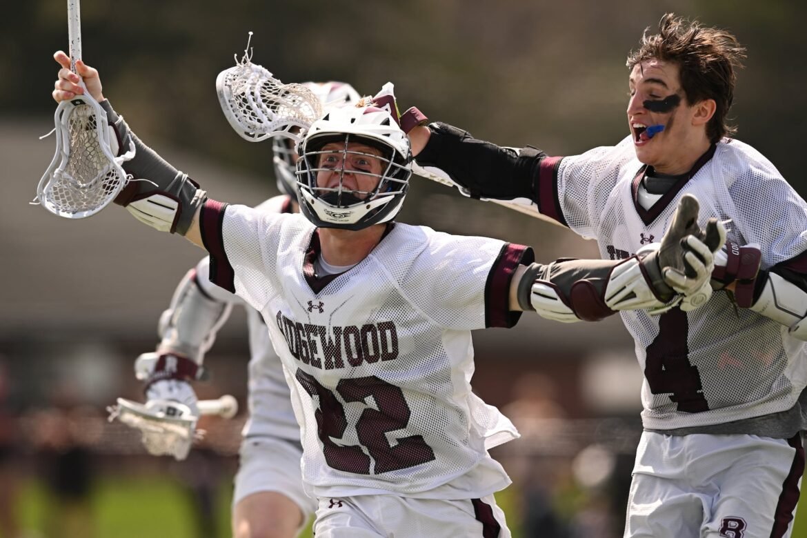 AJ LoSauro (22) of Ridgewood celebrates his game winning goal in overtime during the boys lacrosse game between Chatham and Ridgewood at Cougar Field in Chatham, NJ on Saturday, April 4, 2026.