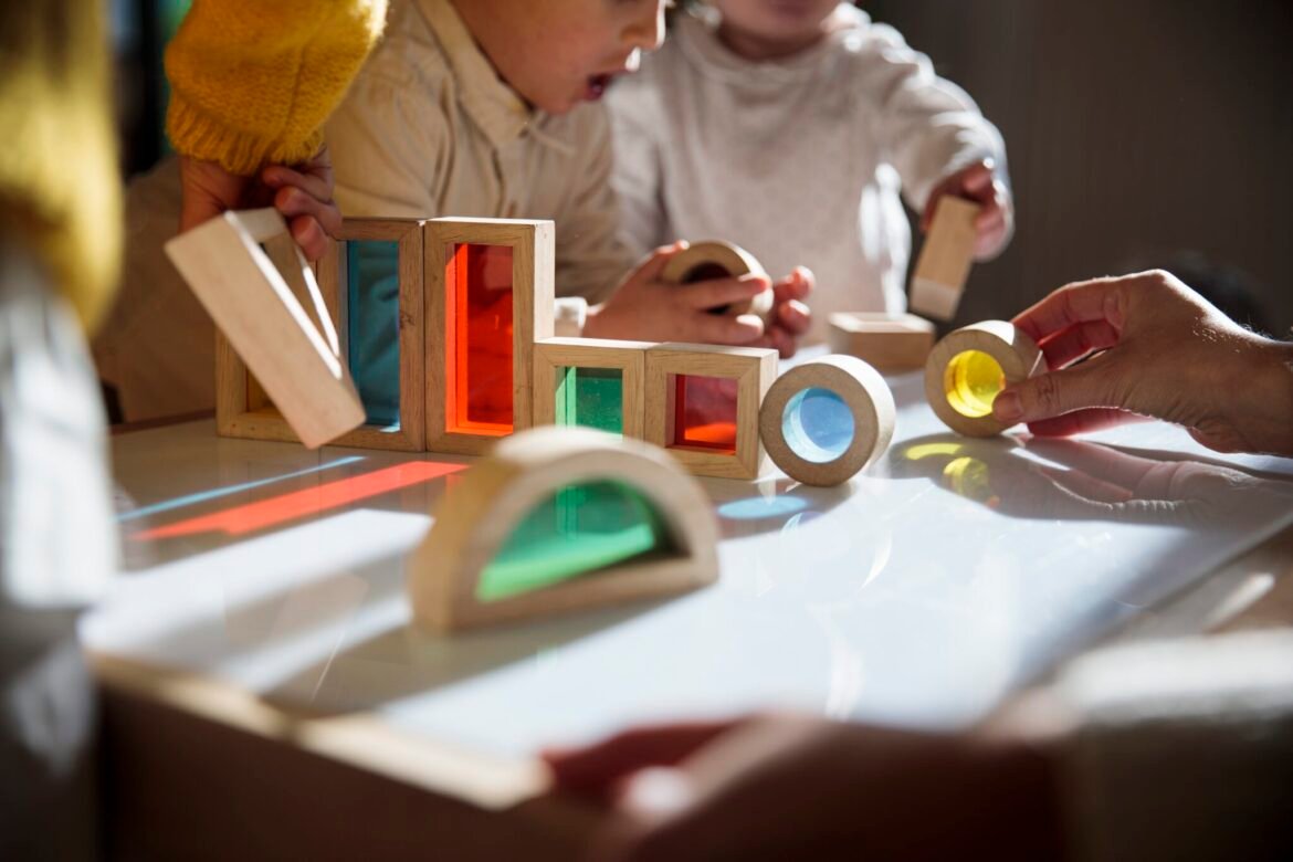 Children playing with colorful wooden building blocks. (Getty Images)&nbsp;