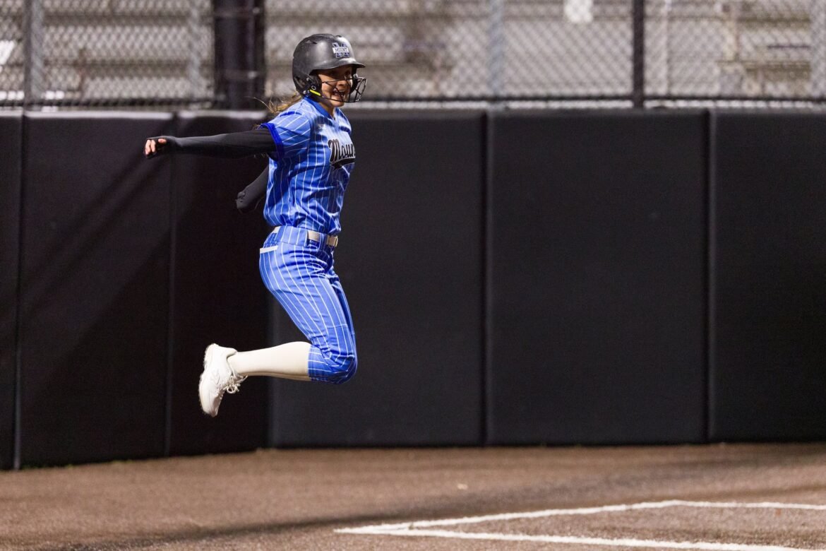 Fran Cutillo of Mount St. Dominic leaps for joy after scoring the winning run against Ramsey in the Public vs. Private High School Softball Challenge at Ivy Hill Park in South Orange on Saturday. The Lions walked it off, 2-1 in 10 innings.  04/04/2026
