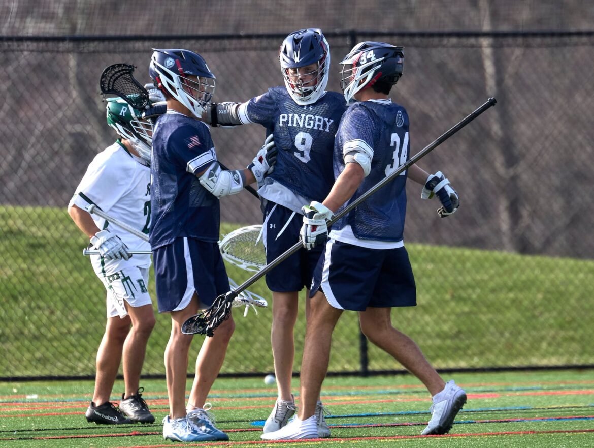 Cliff Field (9) of Pingry celebrates with teammates after scoring a goal against Ridge during the boys lacrosse Skyland Conference game at John Taylor Babbit Memorial Field in Basking Ridge  on Tuesday March 31, 2026.  