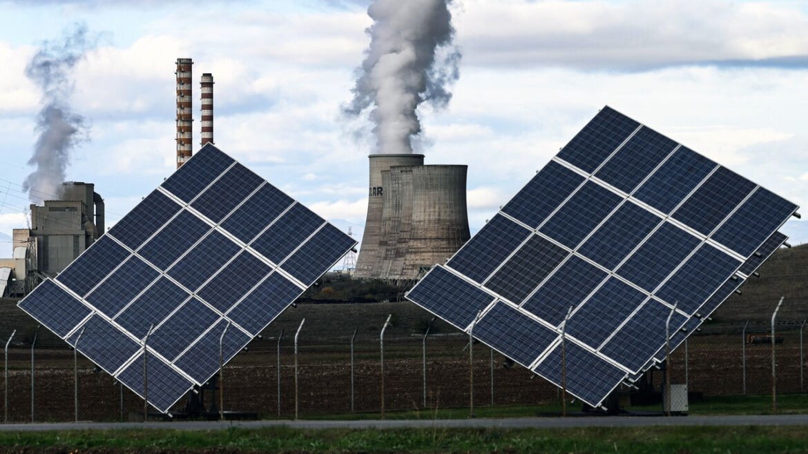 The Agios Dimitrios Power Station, a lignite-fired power plant next to solar panels in Agios Dimitros, near Kozani, northwestern Greece.