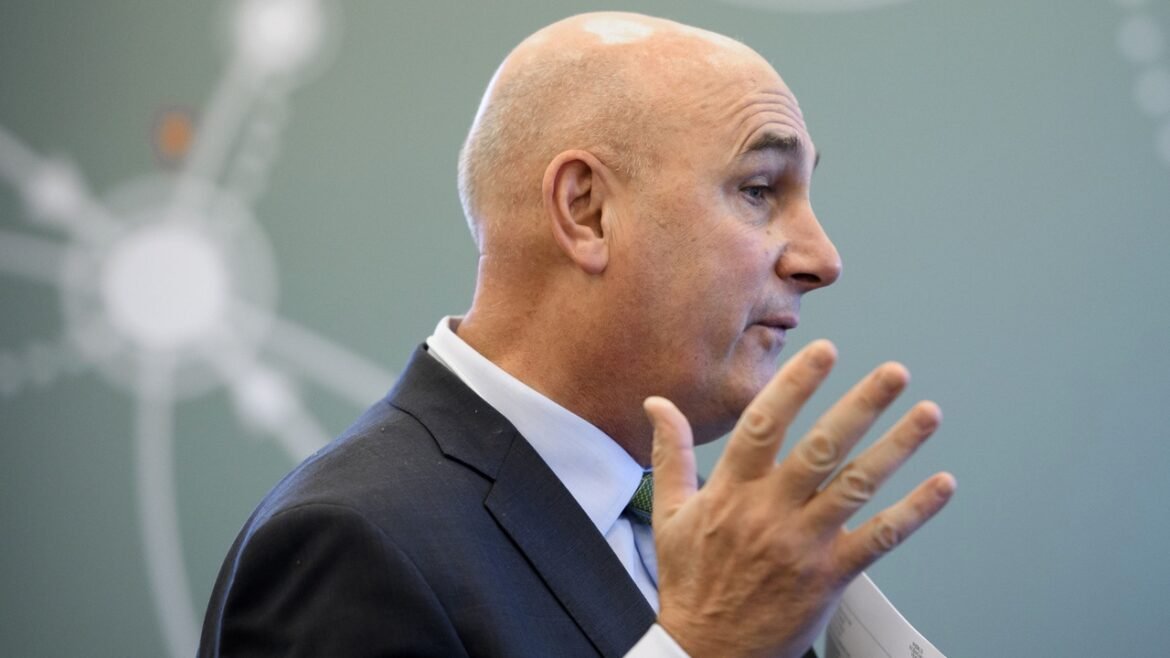 Hugh Grant, CEO of Monsanto, looking away from the camera