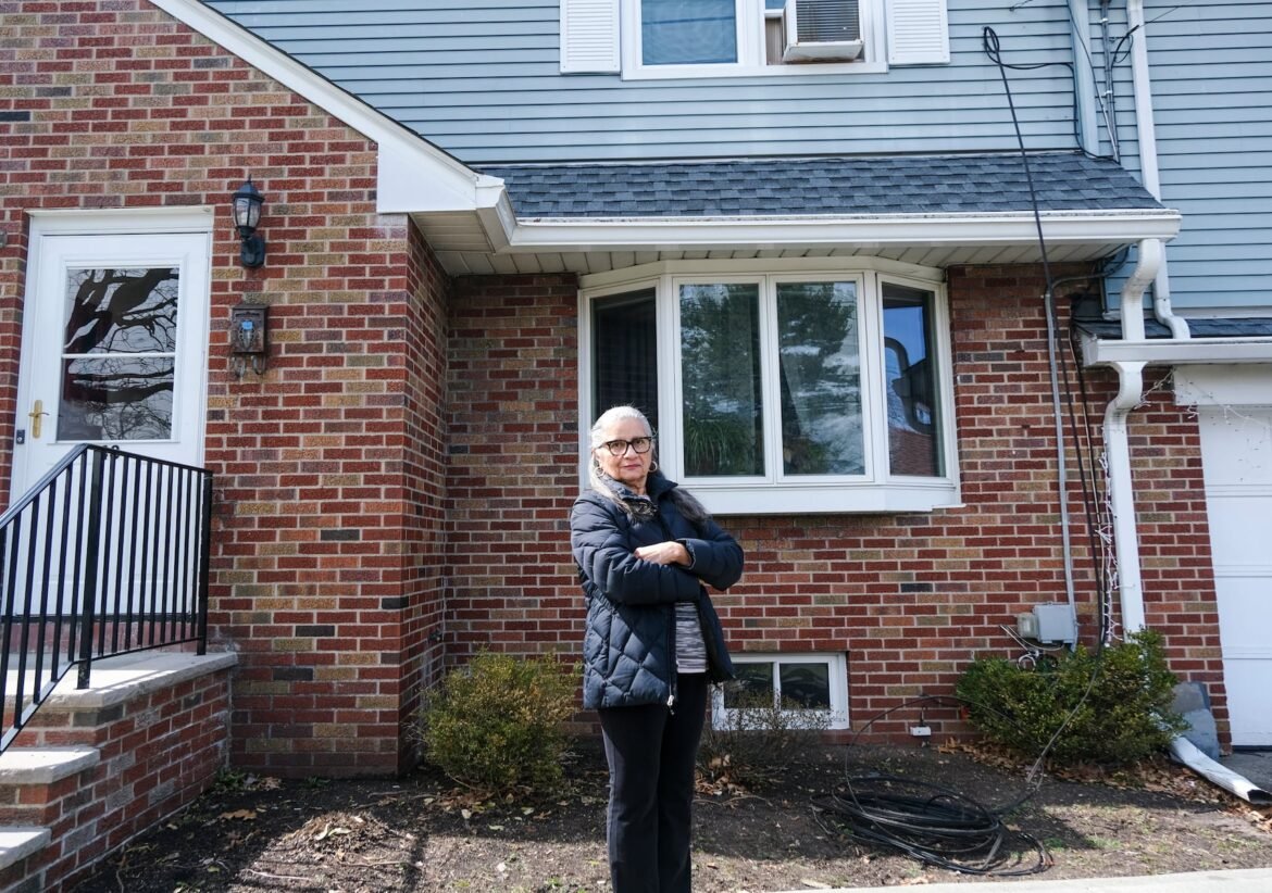 Aida Colon, Bergenfield, NJ, was disappointed that she got no help from Optimum after she requested help removing a loose cable hanging off her house, seen here on Wednesday, March 25, 2026.