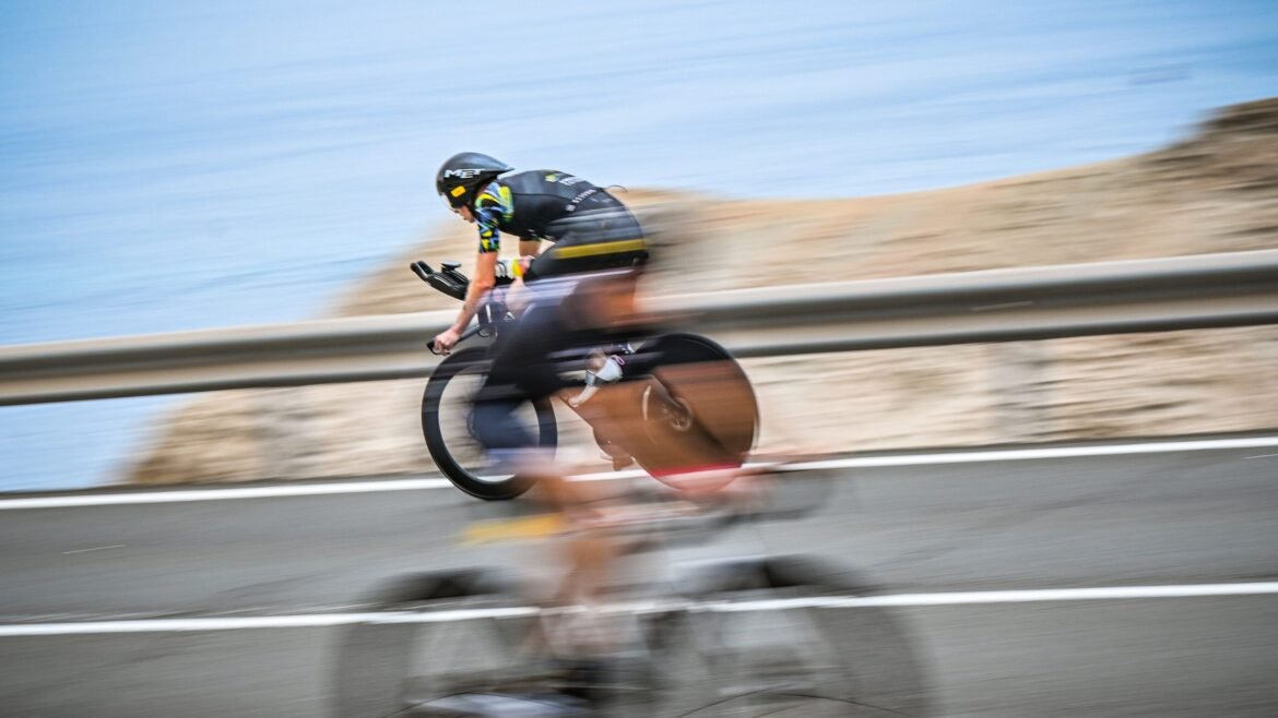 A biker going fast during a triathlon because they completed simple and inexpensive gear upgrades.