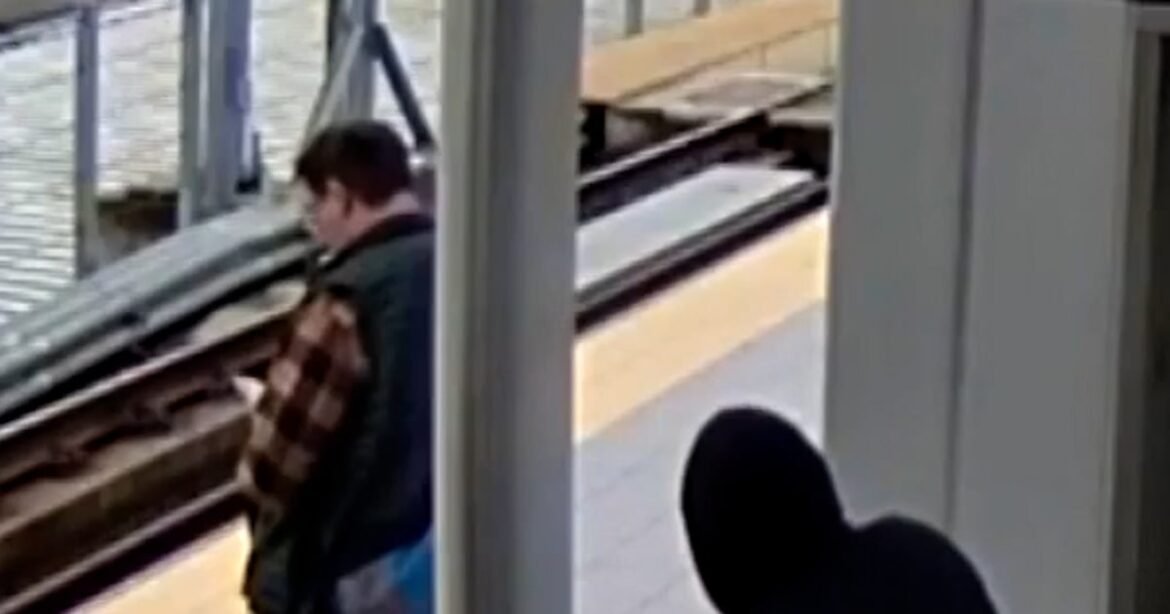 Suspect appears to push man into oncoming train path