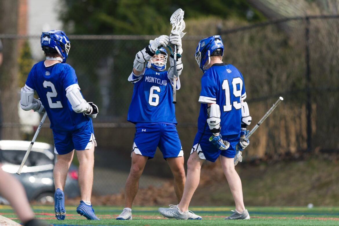 Clive Derba of Montclair (6) celebrates his goal with teammates against Westfield in Friday's high school boys lacrosse matchup in Montclair. The Blue Devils whipped the Mounties, 17-4.  04/10/2026
