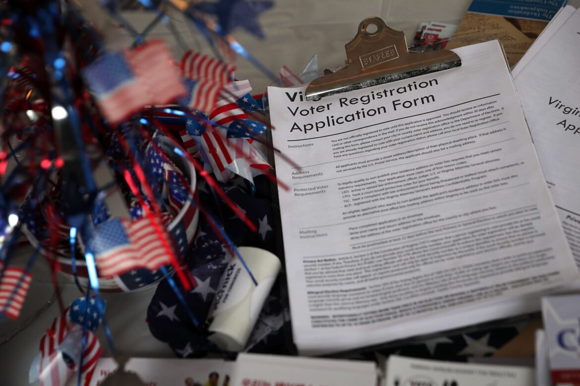 A pile of voter registration forms is seen at the booth of Fairfax County Republican Committee during the annual KORUS festival, a Korean cultural festival, in Tysons Corner, Virginia, in October 2016. (Photo by Alex Wong/Getty Images)